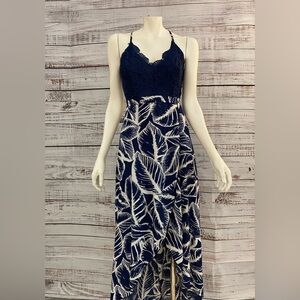 Navy & white floral summer dress with open back, spaghetti straps, & lace detail